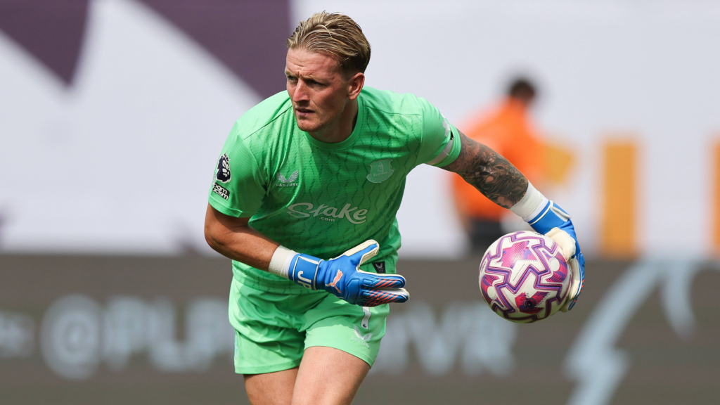 Everton goalkeeper Jordan Pickford rolls the ball out.