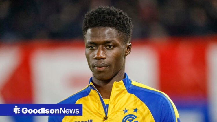 Adama Bojang lining up for Grasshopper Zurich in tracksuit jacket