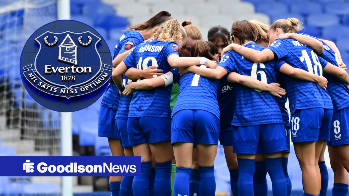 Everton Women huddle together at Goodison Park. An Everton crest is in a circle on the left.