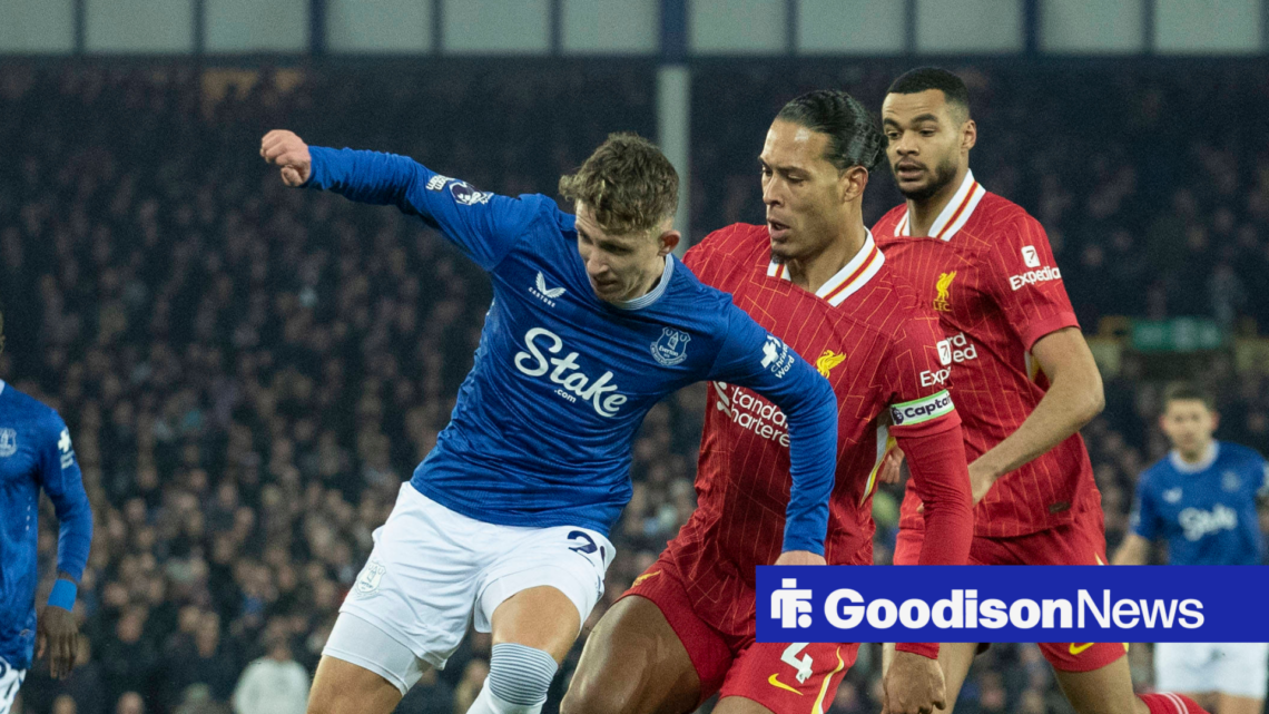 Everton midfielder Jesper Lindstrom challenging Liverpool defender Virgil van Dijk for the ball
