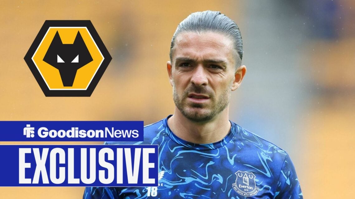 Jack Grealish looking at Wolves badge
