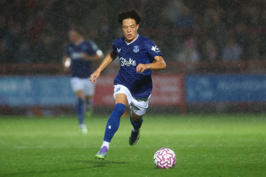 Isaac Heath dribbles the ball in the rain