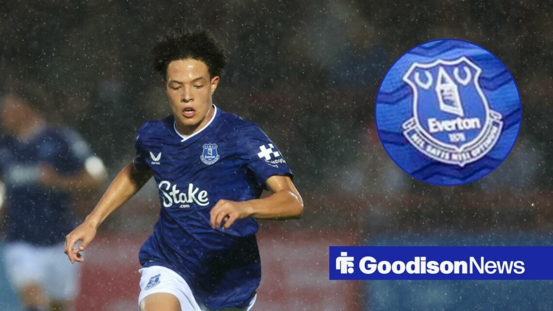 Isaac Heath sprinting in the rain with Everton badge in circle