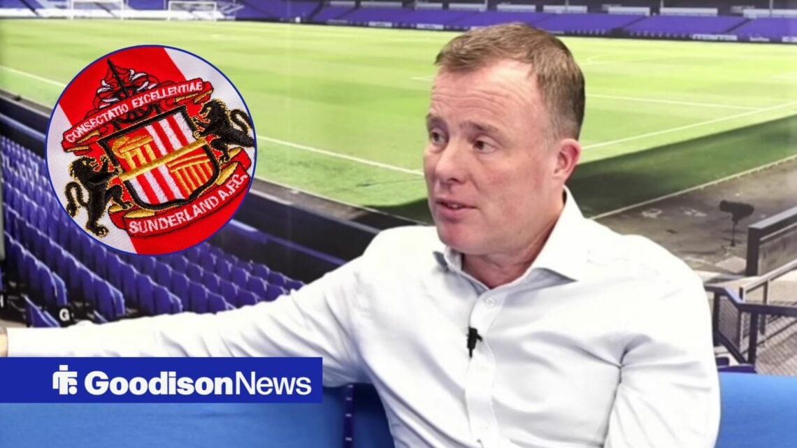 Angus Kinnear looking at Sunderland badge.