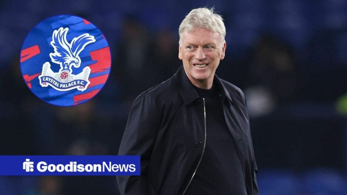 David Moyes smiling and looking at Crystal Palace badge in circle