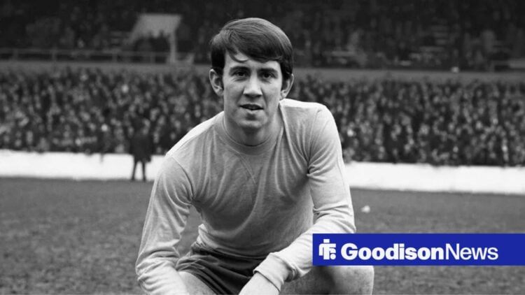 Everton legend Howard Kendall crouching down.