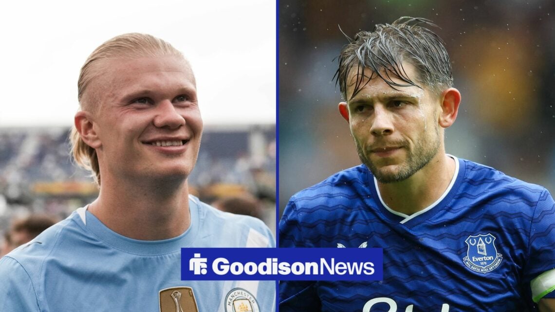 Manchester City striker Erling Haaland smiles and Everton defender James Tarkowski