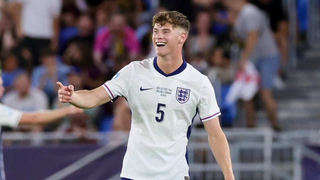 Everton-linked defender Charlie Cresswell smiles and points to his right during a game for England U21s.