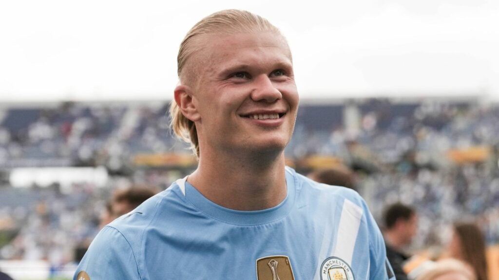 Manchester City star Erling Haaland smiling.