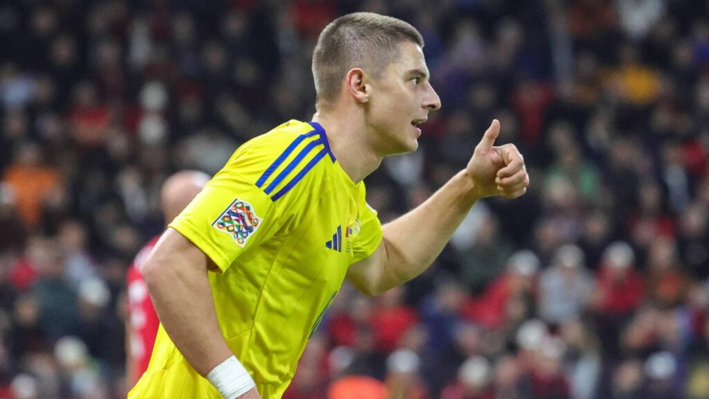 Everton star Vitalii Mykolenko looking happy with Ukraine.