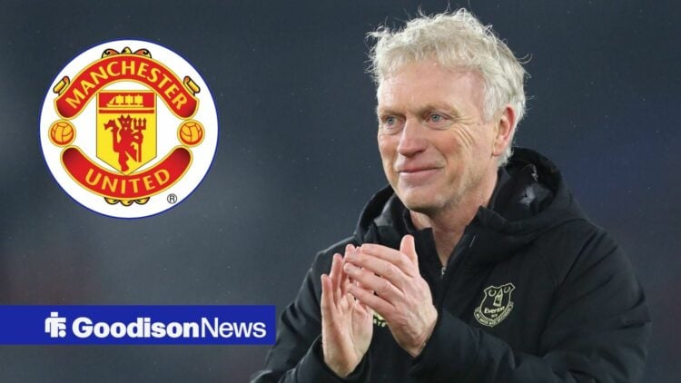 David Moyes smiling at the Manchester United badge.