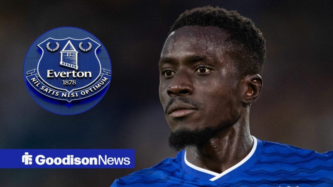 Idrissa Gueye looking at Everton badge in circle
