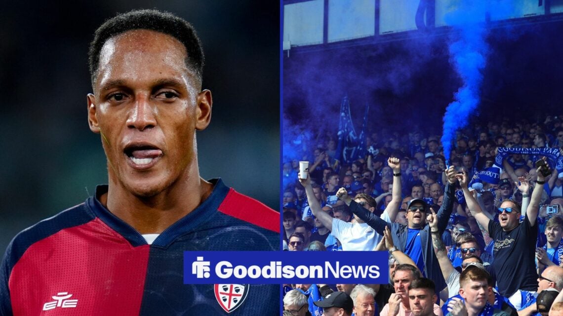 Yerry Mina looking at Everton fans holding flares.