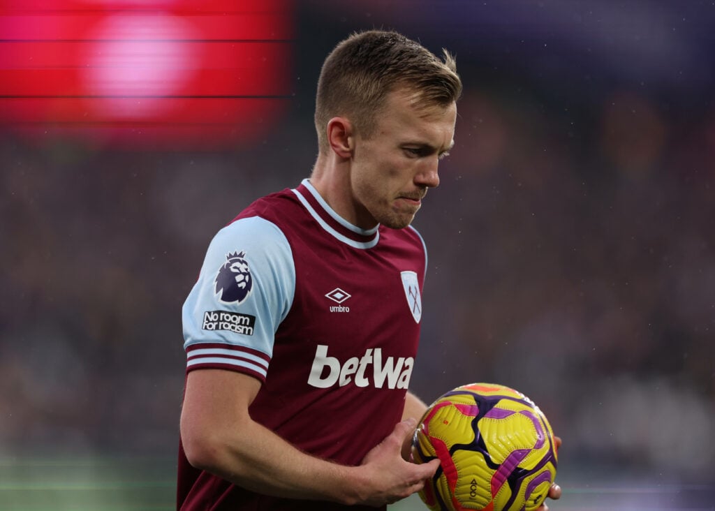 West Ham midfielder James Ward-Prowse prepares to set the ball down for a free-kick.