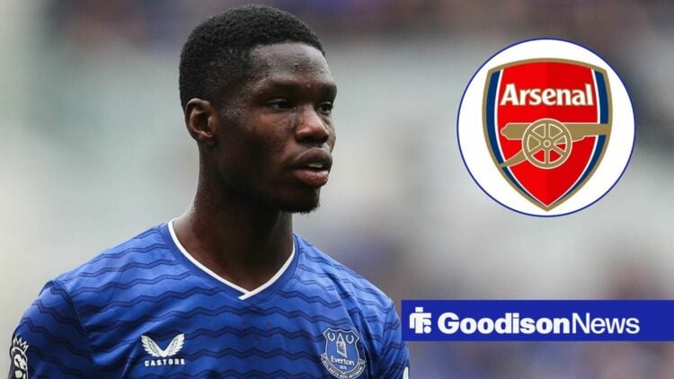 Thierno Barry for Everton, looking at an Arsenal badge that lies in circular inset.