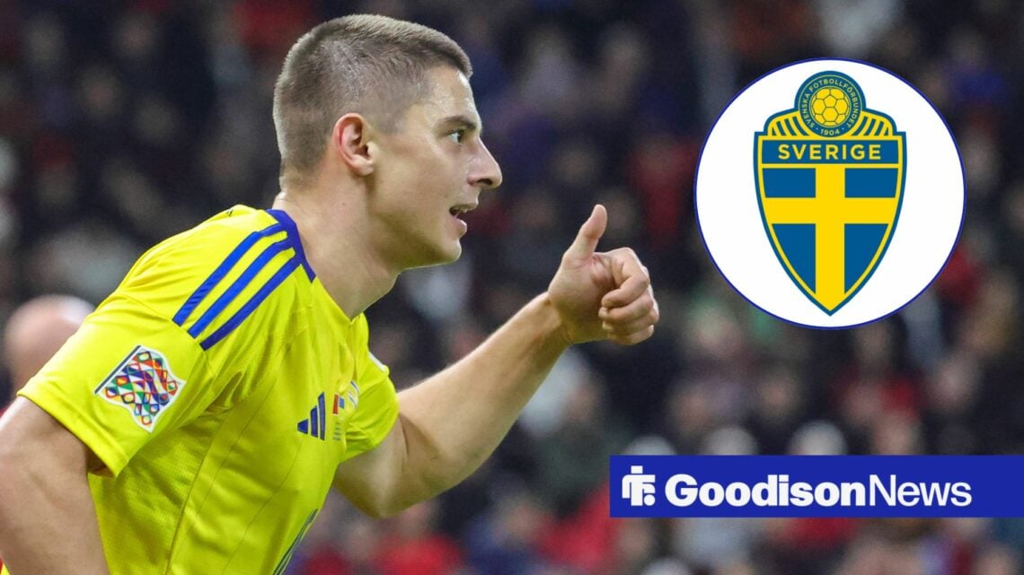 Vitaliy Mykolenko playing for Ukraine holding his thumbs up towards the Sweden badge