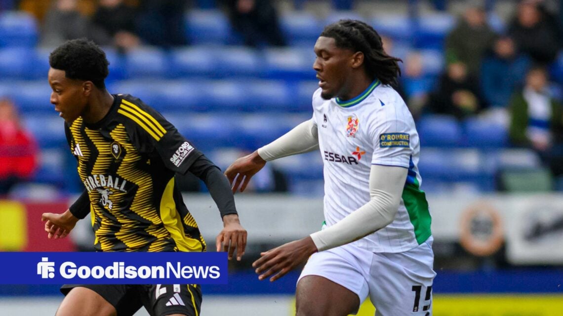 Kallum Cesay of Salford City FC is under pressure from Everton loanee Will Tamen of Tranmere Rovers FC.