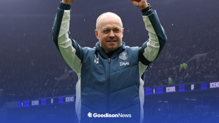 Everton interim boss Scott Phelan smiles and raises his arms aloft