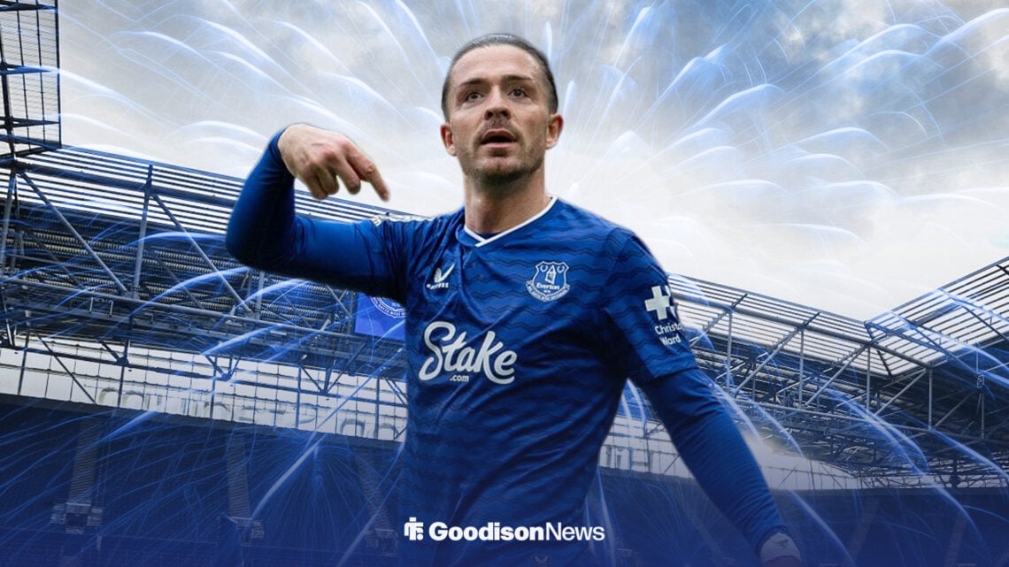 Jack Grealish celebrating at Everton's Hill Dickinson Stadium with blue fireworks behind him.