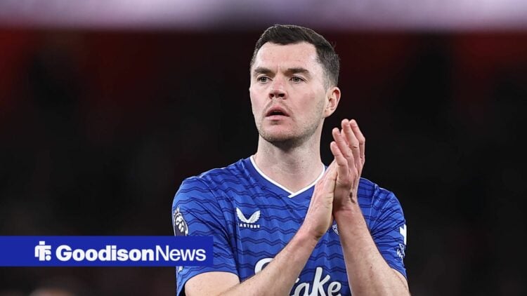 Michael Keane applauds the fans