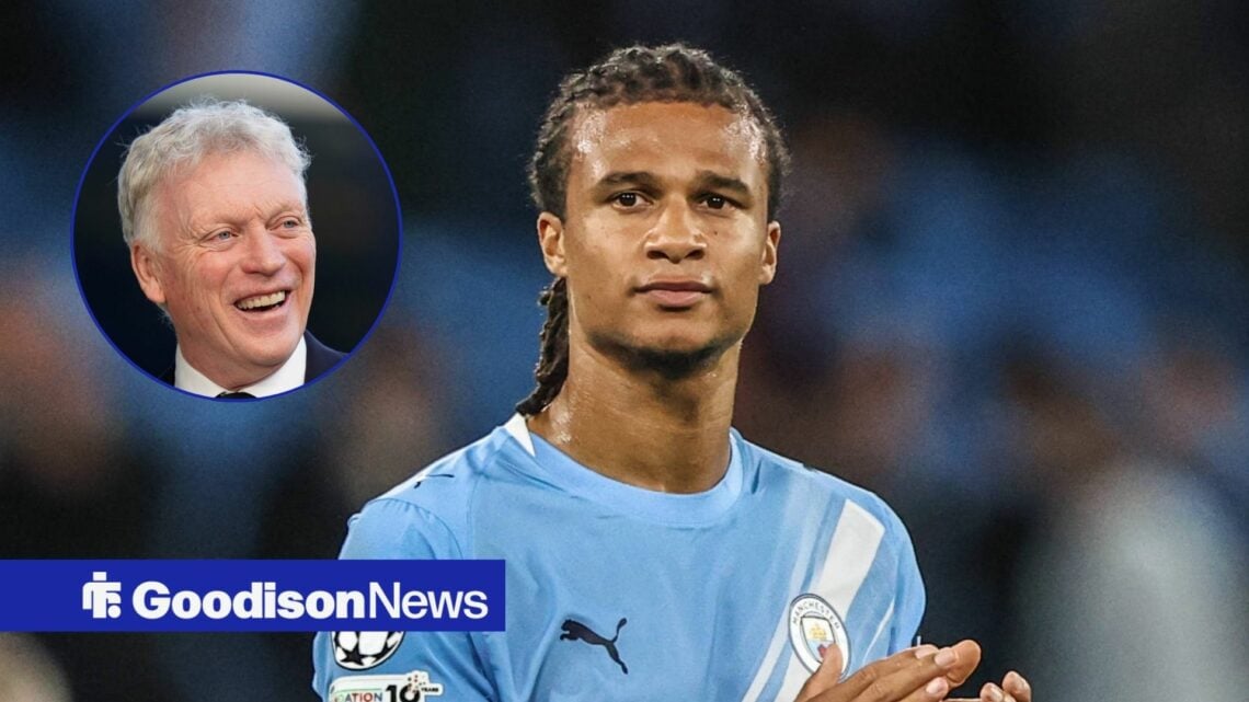 Nathan Ake in action for Man City with David Moyes smiling