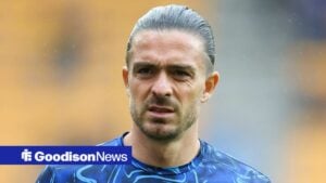 Jack Grealish looks on as Everton warm up